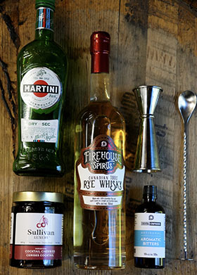A picture of Durham Distillery 's Firehouse Spirits - Canadian 100% Rye Whisky with the ingredients to make a Manhattan Cocktail