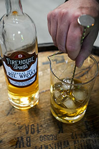 Stirring a Manhattan cocktail made with Durham Distillery's Firehouse Spirits - Canadian 100% Rye Whisky