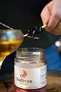Perparing a garnish of Sullivan Luxury cherries for the Manhattan cocktail